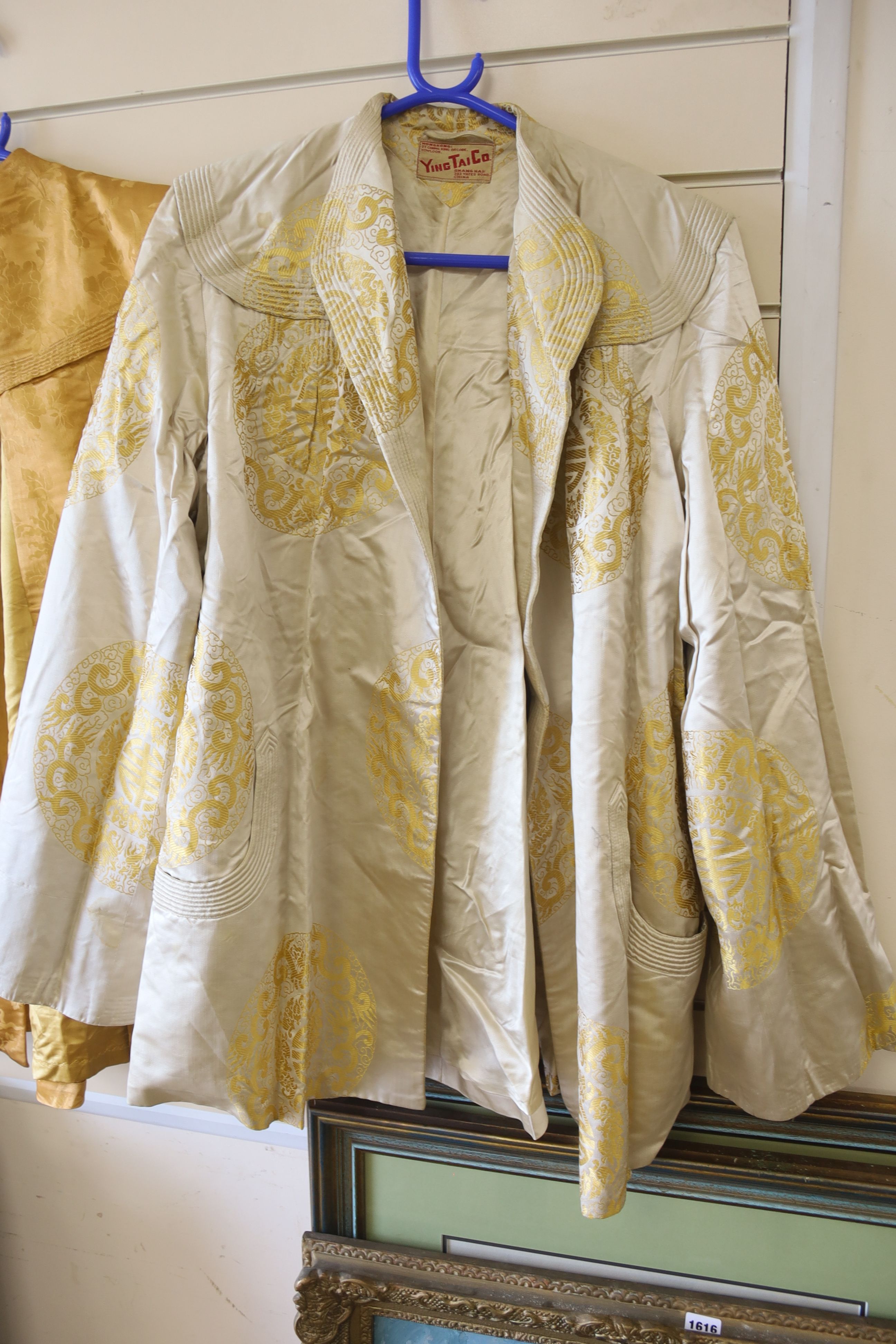 A 1940's Chinese yellow damask jacket, length 87cm, and a similar brocade jacket